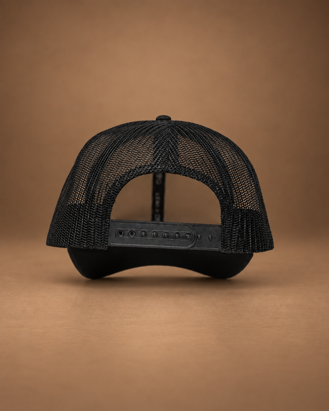 Adjustable snapback closure on black GOD F1RST trucker hat