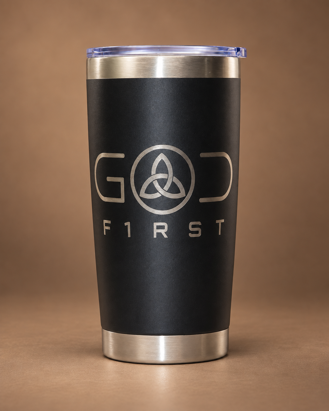 Front of matte black 20 oz GOD F1RST tumbler with laser-engraved Trinity knot logo